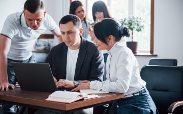 doing-it-together-business-people-and-manager-working-on-their-new-project-in-classroom